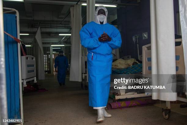 Member of the Ugandan Medical staff of the Ebola Treatment Unit stands inside the ward in Personal Protective Equipment at Mubende Regional Referral...
