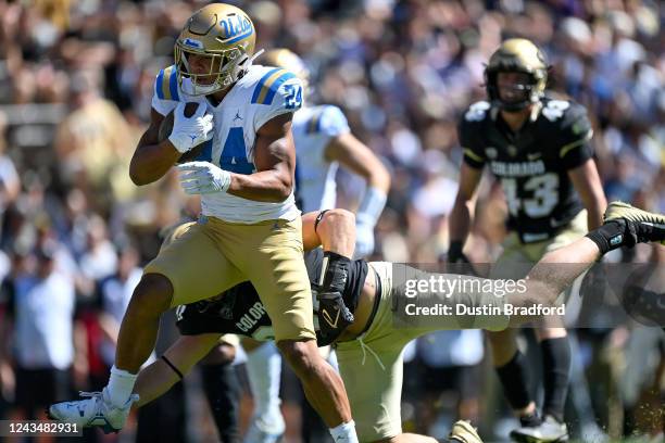 Running back Zach Charbonnet of the UCLA Bruins carries the ball for a second quarter touchdown against the Colorado Buffaloes at Folsom Field on...