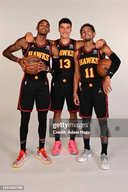 Dejounte Murray, Bogdan Bogdanovi, and Trae Young of the Atlanta Hawks pose for a portrait during NBA Media Day on September 23, 2022 at PC&E Studio...