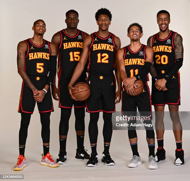 Dejounte Murray, Clint Capela, De'Andre Hunter, Trae Young, and John Collins of the Atlanta Hawks pose for a portrait during NBA Media Day on...