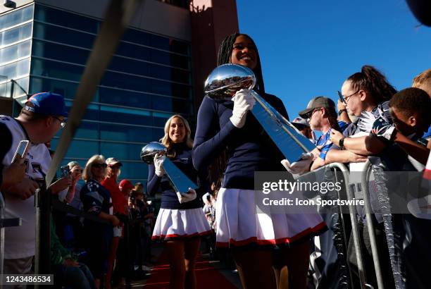 New England Patriots cheerleaders bring in the 6 Super Bowl trophies during the induction of Vince Wilfork into the New England Patriots Hall of Fame...