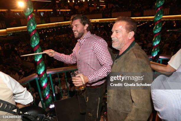 Christopher Schwarzenegger and Arnold Schwarzenegger conduct the band during the 187th Oktoberfest at Marstall tent /Theresienwiese on September 24,...