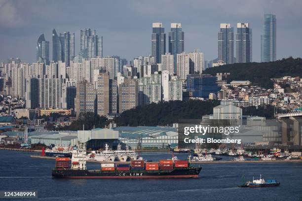 Container ship sails past buildings in Busan, South Korea, on Thursday, Sept. 22, 2022. Bank of Korea Governor Rhee Chang-yong widened the door for...