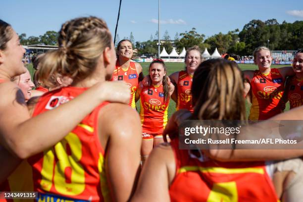 The Gold Coast Suns sing the team song after the 2022 S7 AFLW Round 05 match between the Gold Coast Suns and the Port Adelaide Power at Bond...