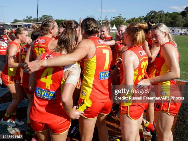 The Gold Coast Suns sing the team song after the 2022 S7 AFLW Round 05 match between the Gold Coast Suns and the Port Adelaide Power at Bond...