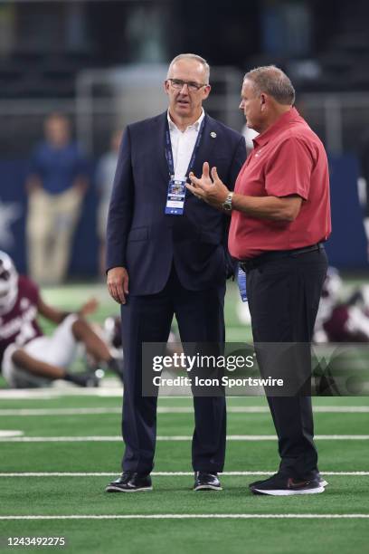 Commissioner Greg Sankey and Arkansas coach Sam Pittman talk before the Southwest Classic between the Arkansas Razorbacks and the Texas A&M Aggies on...