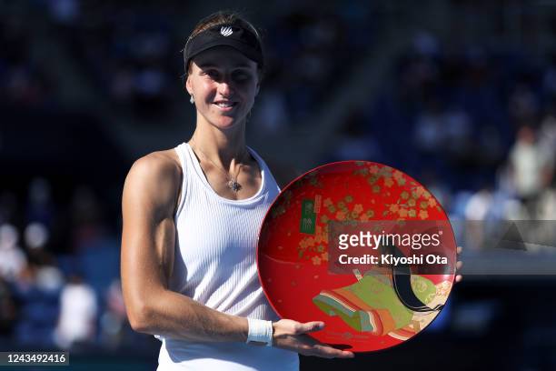Ludmilla Samsonova of Russia celebrates with the trophy after winning the Singles final match against Zheng Qinwen of China during day seven of the...