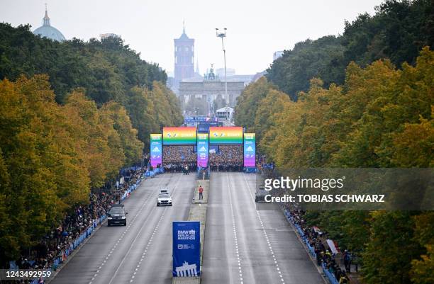 Athletes prepare to take the start of the Berlin Marathon race on September 25, 2022 close to the Brandenburg Gate in Berlin. - The course record was...