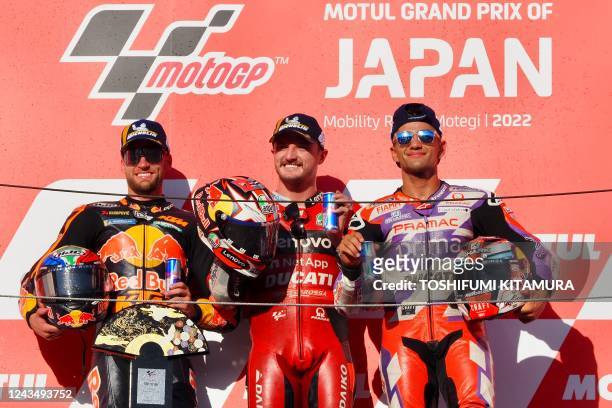 MotoGP Japanese Grand Prix winner Ducati Lenovo team rider Jack Miller of Australia celebrates with second-placed Red Bull KTM Factory Racing rider...