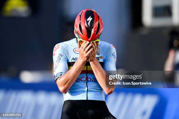 Remco Evenepoel of Belgium celebrates on his way to winning the race during the Men's Elite Road Race at the UCI Road World Championship in...