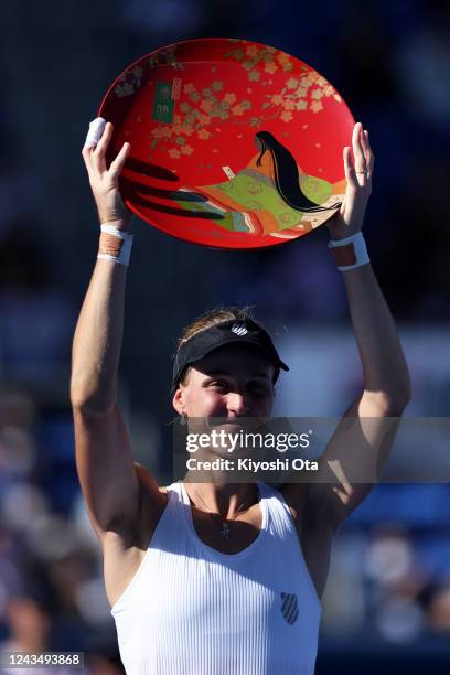 Ludmilla Samsonova of Russia celebrates with the trophy after winning the Singles final match against Zheng Qinwen of China during day seven of the...