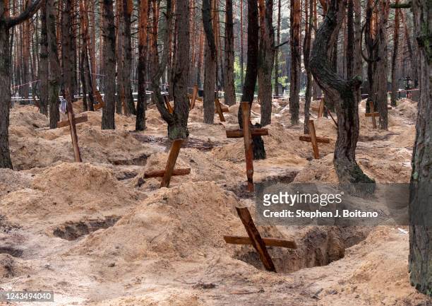 Graves sit empty as a part of an investigation of war crimes in Izium, Ukraine. Over 400 bodies were recovered from mass graves in Izium after...