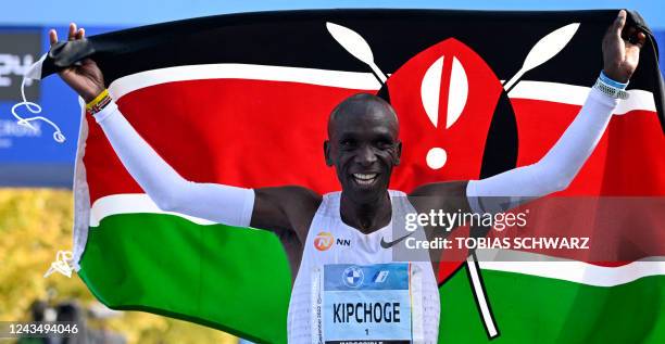 Kenya's Eliud Kipchoge celebrates after winning the Berlin Marathon race on September 25, 2022 in Berlin. - Kipchoge has beaten his own world record...