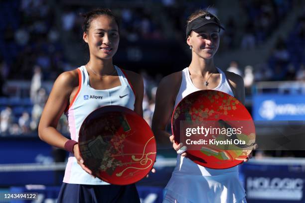 Winner Ludmilla Samsonova of Russia and runner-up Zheng Qinwen of China celebrate after the Singles final match during day seven of the Toray Pan...