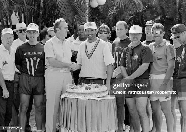 England captain Graham Gooch is presented with a cake to commemorate his 100th Test match by chairman of selectors Ted Dexter before before the 1st...