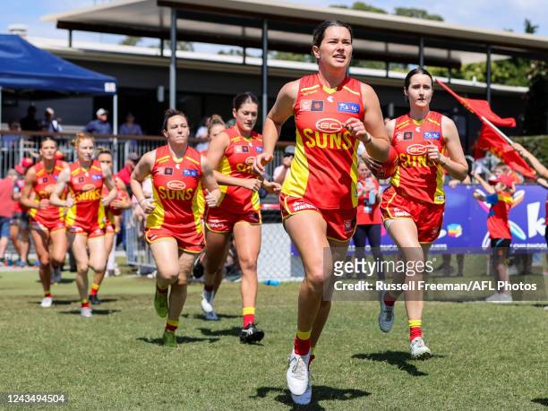 Lauren Ahrens of the Suns enters the field during the 2022 S7 AFLW Round 05 match between the Gold Coast Suns and the Port Adelaide Power at Bond...