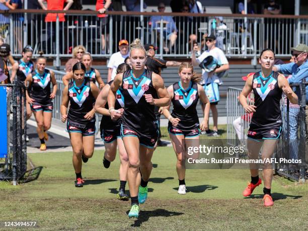 Erin Phillips of the Power leads the team out during the 2022 S7 AFLW Round 05 match between the Gold Coast Suns and the Port Adelaide Power at Bond...