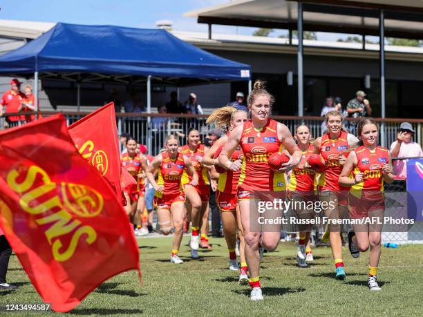 Tara Bohanna of the Suns leads the team out during the 2022 S7 AFLW Round 05 match between the Gold Coast Suns and the Port Adelaide Power at Bond...