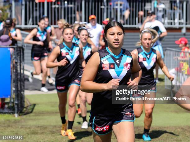 Hannah Ewings of the Power enters the field during the 2022 S7 AFLW Round 05 match between the Gold Coast Suns and the Port Adelaide Power at Bond...