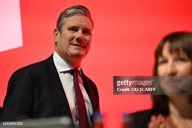 Britain's main opposition Labour Party leader Keir Starmer arrives on the podium on the first day of the annual Labour Party conference in Liverpool,...