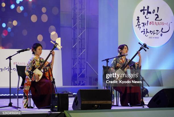 Musicians play Tsugaru shamisen, a traditional three-stringed musical instrument deriving from Aomori Prefecture, northeastern Japan, at the annual...