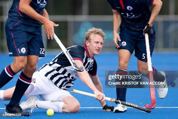 Herakles' Belgian forward Amaury Keusters is challenged during the Belgian men field hockey league game between Royal Herakles Hockey Club and Royal...