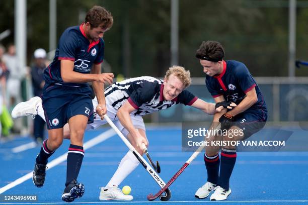Leuven's Pere Divorra, Herakles' Amaury Keusters and Leuven's Arthur Delhalle pictured in action during a hockey game between Royal Herakles Hockey...