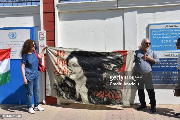 People gather in front of the United Nations building during a protest triggered by the brutal death of 22-year-old Mahsa Amini, after being arrested...