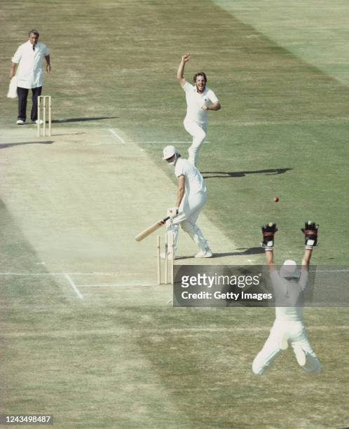 England bowler Ian Botham celebrates after bowling Terry Alderman for 0 as wicketkeeper Bob Taylor leaps to celebrate as England defeat Australia by...