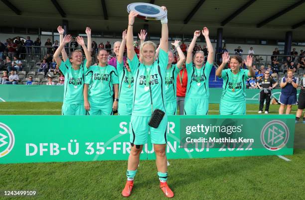 Players of FFC Asbach Uralt Essen pose with the trophy after winning the women's over 35 cup during the DFB Senior over 40 and over 50 cup at Stadion...