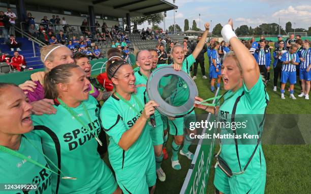 Players of FFC Asbach Uralt Essen pose with the trophy after winning the women's over 35 cup during the DFB Senior over 40 and over 50 cup at Stadion...