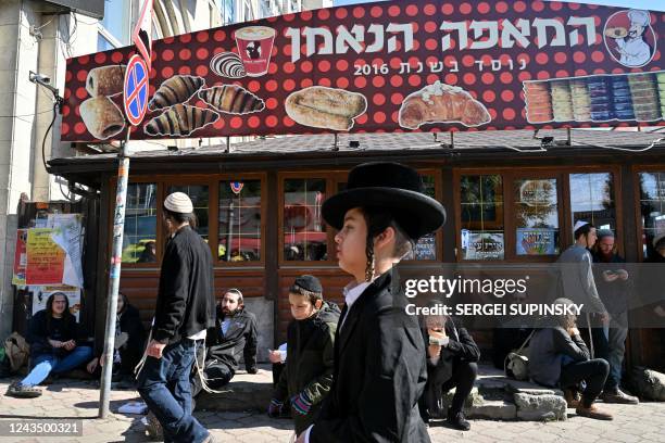 Young Hasidic Jewish pilgrim walks after pray at tomb of Rabbi Nachman for Rosh Hashana, the Jewish new year, in town of Uman, some 200km from...