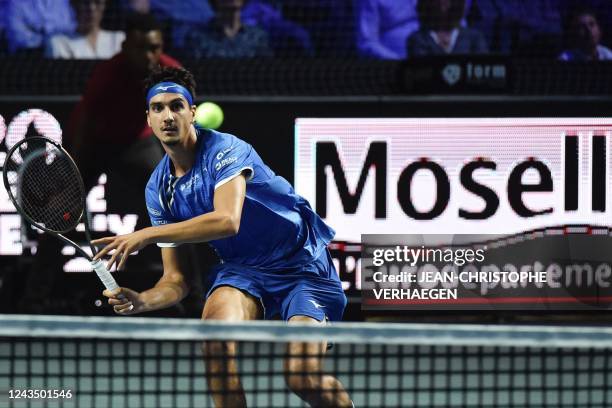 Italys Lorenzo Sonego returns a ball to Kazakhstans Alexander Bublik during the ATP Moselle Open final tennis match in Metz, northeastern France on...