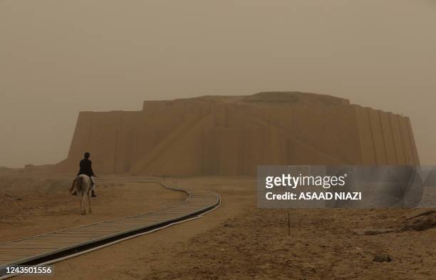 Dust storm engulfs the Great Ziggurat temple in the ancient city of Ur in Iraq's southern province of Dhi Qar near the city of Nasiriyah on September...