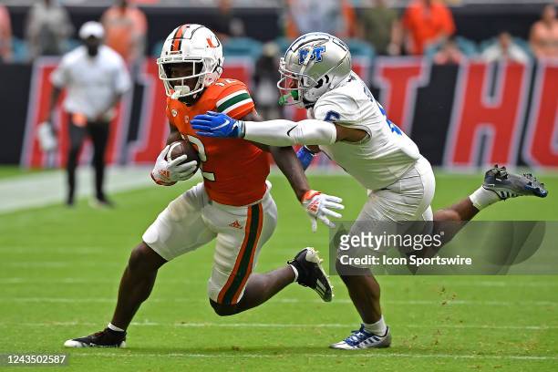 Miami wide receiver Brashard Smith attempts to evade Middle Tennessee cornerback Deidrick Stanley II after a reception in the first quarter as the...