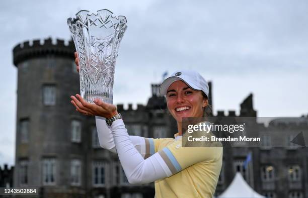 Clare , Ireland - 25 September 2022; Klara Spilkova of Czech Republic celebrates with the trophy in front of Dromoland Castle after winning on the...