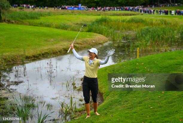 Clare , Ireland - 25 September 2022; Klara Spilkova of Czech Republic reacts to the applause from the gallery after chipping out of a water hazard at...