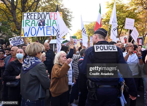 People take part in solidarity protest on September 25 in Paris, France, for Mahsa Amini, a 22 years old Iranian woman who died under custody after...