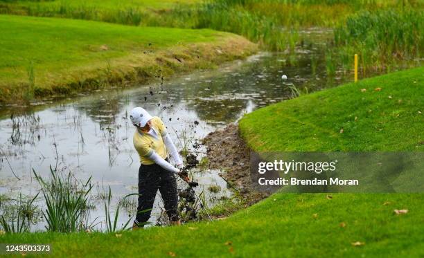 Clare , Ireland - 25 September 2022; Klara Spilkova of Czech Republic chips out of a water hazard at the 17th green during round four of the KPMG...