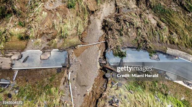 View of the road 824 leading to Puente los cocos to Rio de La Plata river on Sept. 20 in Toa Alta, which was damaged by the river over flooding...