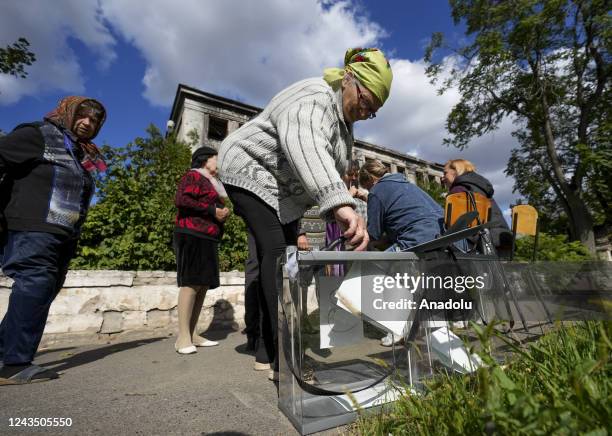 People cast their votes in controversial referendums in Donetsk Oblast, Ukraine on September 25, 2022. Voting will run from Friday to Tuesday in...