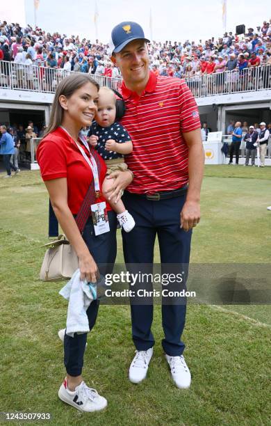 Jordan Spieth of the United States Team and his wife Annie Speith and their baby during the final round Sunday singles matches of Presidents Cup at...