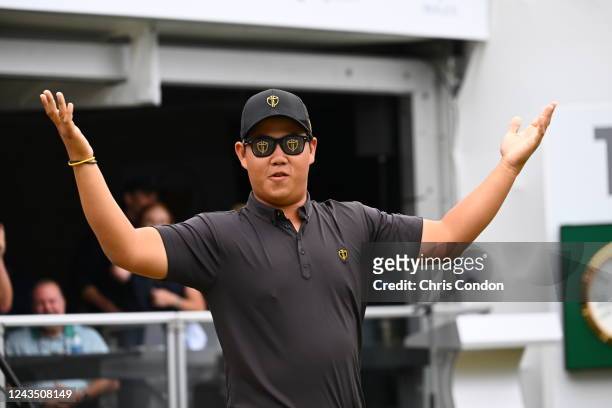 International Team Member Tom Kim of South Korea asks the crowd for more noise as he arrives on the first tee during the final round Sunday singles...