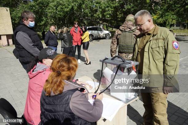 People cast their votes in controversial referendums in Mariupol, Donetsk Oblast, Ukraine on September 25, 2022. Voting will run from Friday to...