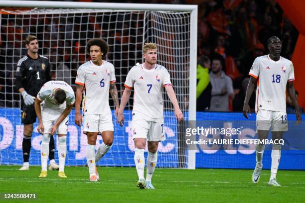 Belgium's Axel Witsel, Belgium's Kevin De Bruyne and Belgium's Amadou Onana look dejected during a soccer game between the Netherlands and Belgian...