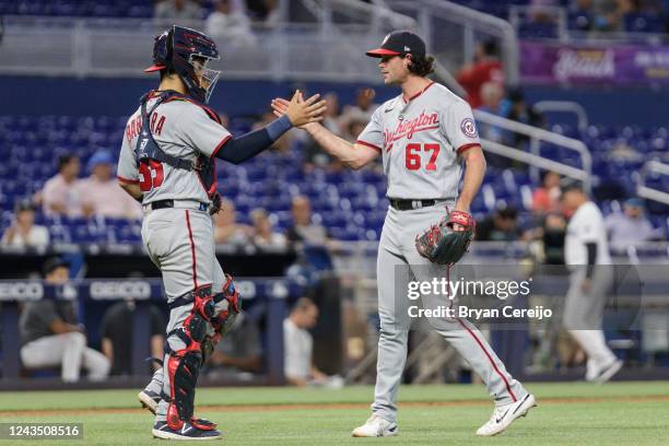 Tres Barrera of the Washington Nationals and Kyle Finnegan of the Washington Nationals celebrate after closing out the game against the Miami Marlins...