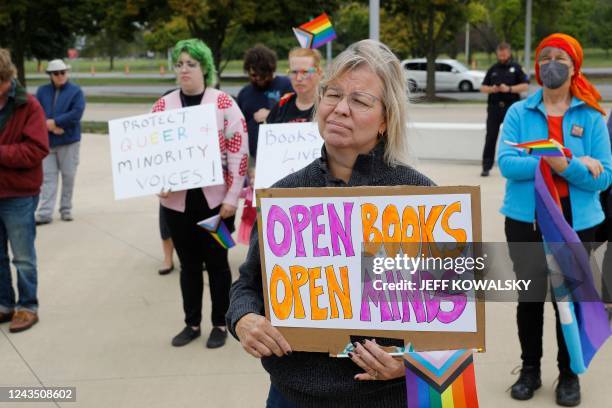 Demonstrators gather to protest against banning books outside of the Henry Ford Centennial Library in Dearborn, Michigan, on September 25, 2022. -...