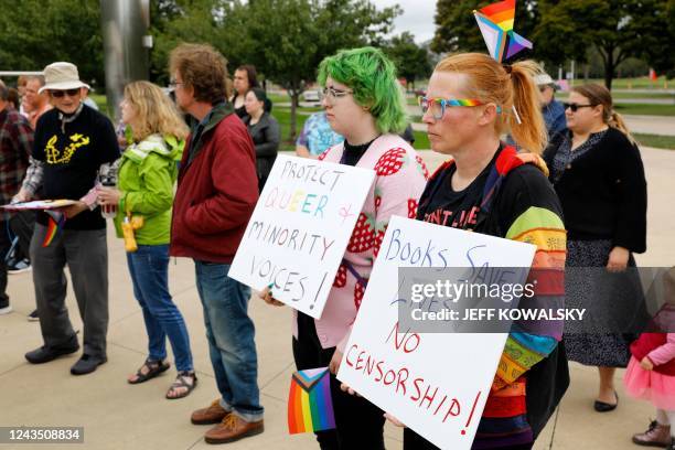 Demonstrators gather to protest against banning books outside of the Henry Ford Centennial Library in Dearborn, Michigan, on September 25, 2022. -...