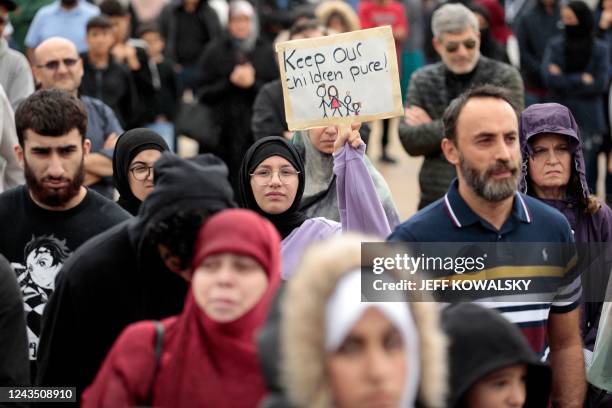 Demonstrators who support banning books gather during a protest outside of the Henry Ford Centennial Library in Dearborn, Michigan, on September 25,...