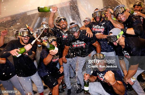 The Cleveland Guardians celebrate after defeating the Texas Rangers 10-4 and clinching the American League Central Division at Globe Life Field on...